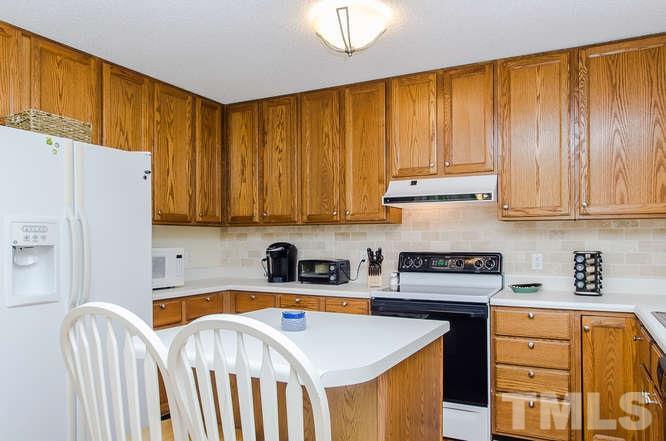 1912 Old Greenfield Road Raleigh, NC 27604 - Photo 11 of 25 a kitchen with stainless steel appliances granite countertop a refrigerator sink and cabinets