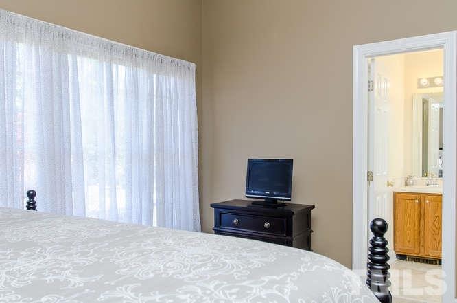 1912 Old Greenfield Road Raleigh, NC 27604 - Photo 13 of 25 a bedroom with a bed and a tv