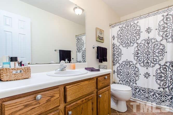 1912 Old Greenfield Road Raleigh, NC 27604 - Photo 14 of 25 a bathroom with a sink toilet and shower