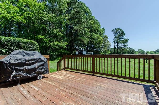 1912 Old Greenfield Road Raleigh, NC 27604 - Photo 18 of 25 a view of a wooden deck and a backyard