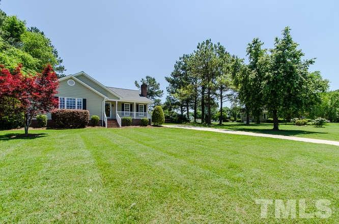 1912 Old Greenfield Road Raleigh, NC 27604 - Photo 23 of 25 a front view of house with yard and green space