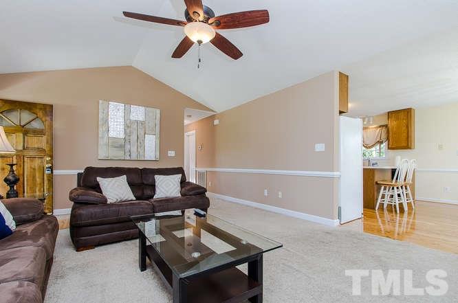1912 Old Greenfield Road Raleigh, NC 27604 - Photo 6 of 25 a living room with furniture and a potted plant