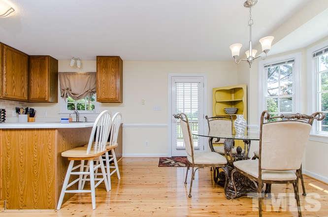 1912 Old Greenfield Road Raleigh, NC 27604 - Photo 8 of 25 a view of a dining room with furniture and wooden floor