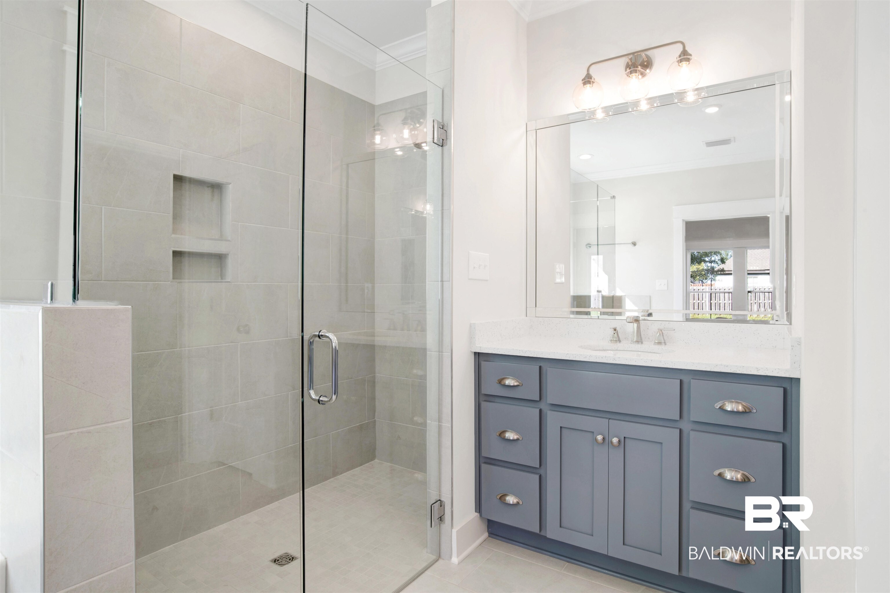 9687 Widgeon Court Daphne, AL 36526 - Photo 22 of 40 Bathroom with vanity, tile patterned floors, a shower with door, and crown molding