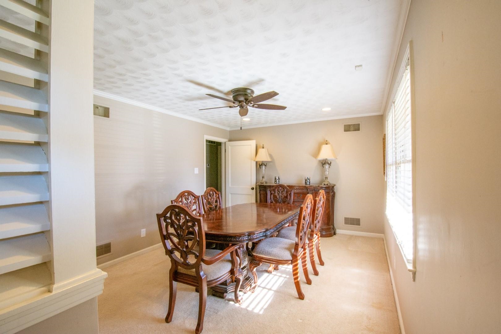 5006 New Castle Road Memphis, TN 38117 - Photo 8 of 20 a view of a dining room with furniture and a chandelier