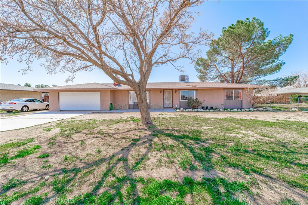 21797 Carlisle Road Apple Valley, CA 92307 - Photo 1 of 1 front view of a house with a yard