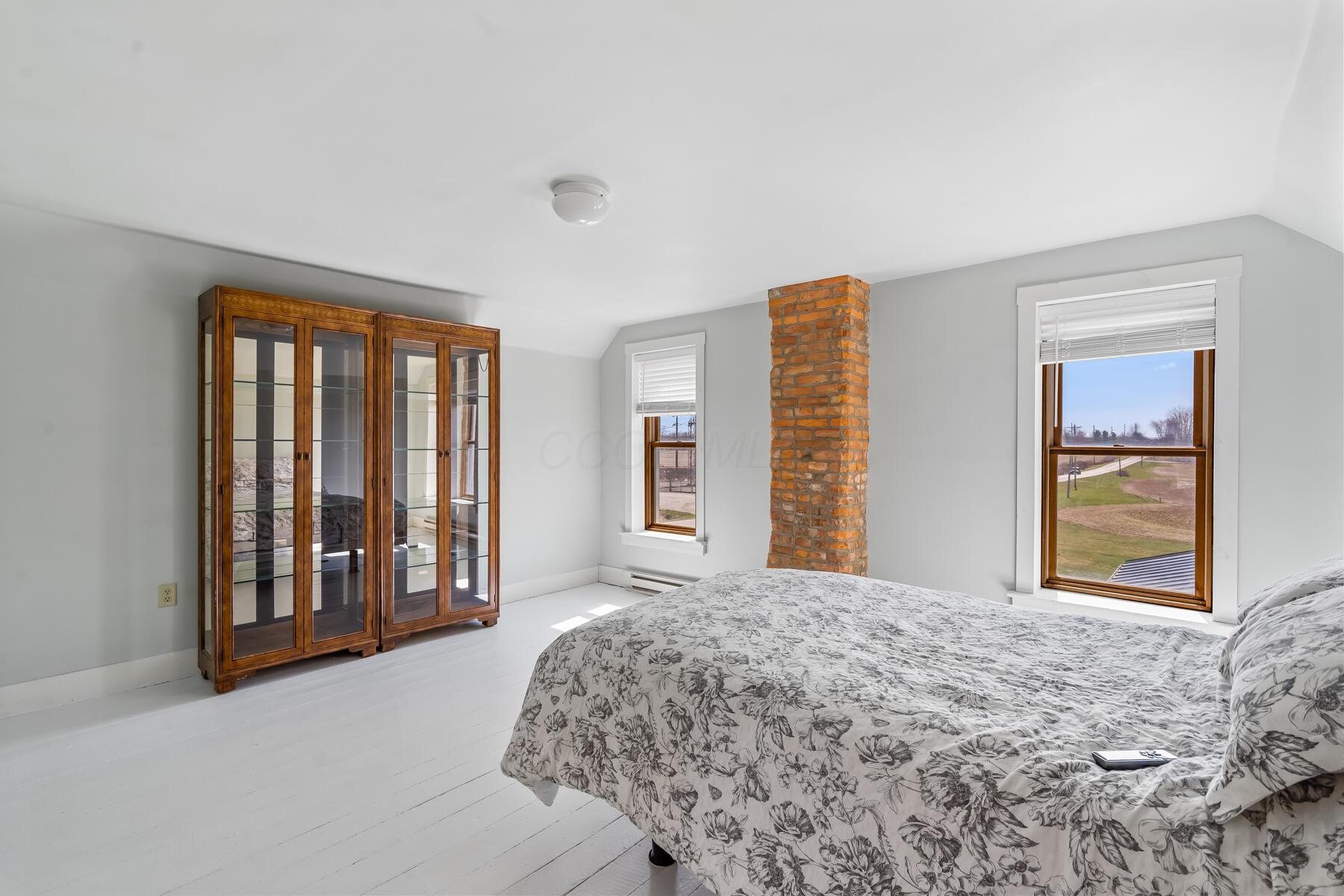 7277 Condit Road Centerburg, OH 43011 - Photo 21 of 41 Upstairs Bedroom with brick chimney accent