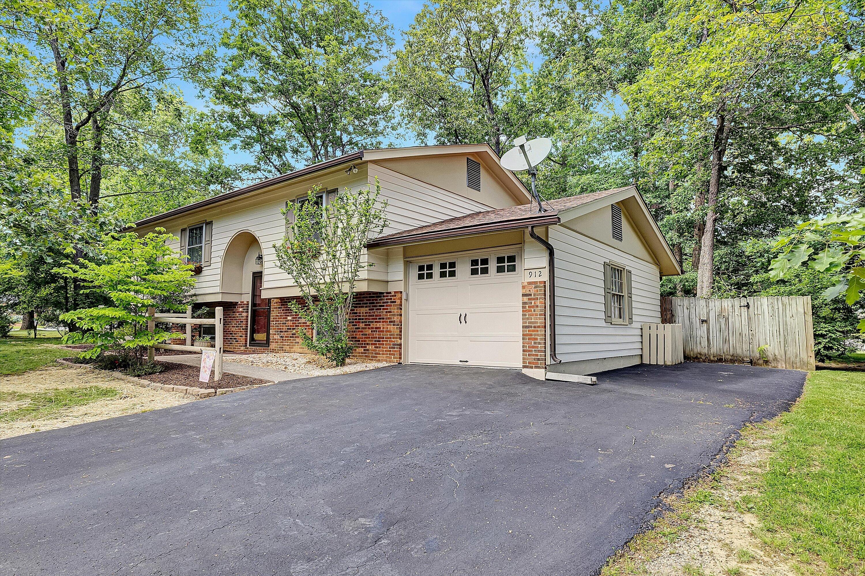 912 Cherokee Trail Covington, VA 24426 - Photo 1 of 31 a view of a house with a yard and large tree