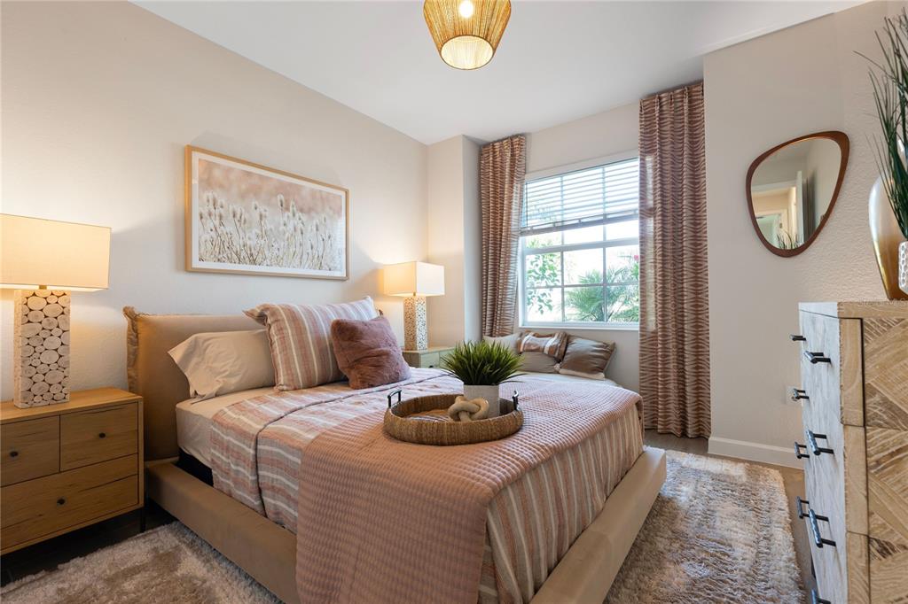 7157 Inlet Isles Lakewood Ranch, FL 34202 - Photo 18 of 26 a bedroom with a bed and a window