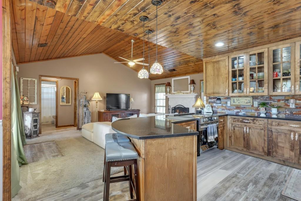 429 Red Oak Court Monroe, GA 30655 - Photo 11 of 40 a kitchen with granite countertop a stove and cabinets