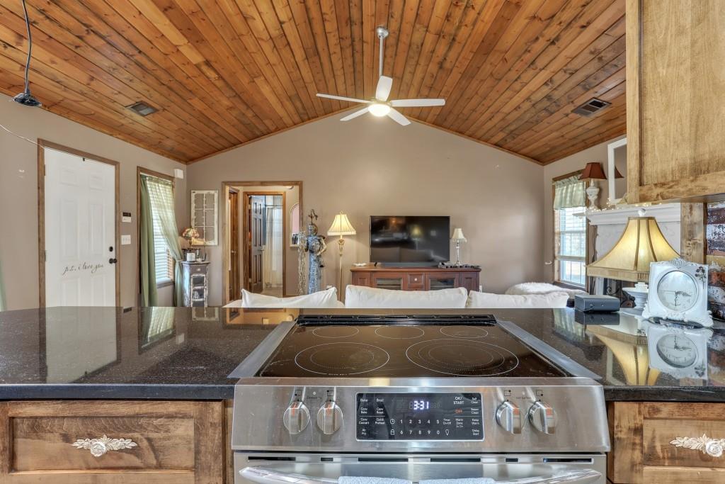 429 Red Oak Court Monroe, GA 30655 - Photo 13 of 40 a kitchen with a stove a sink and a refrigerator