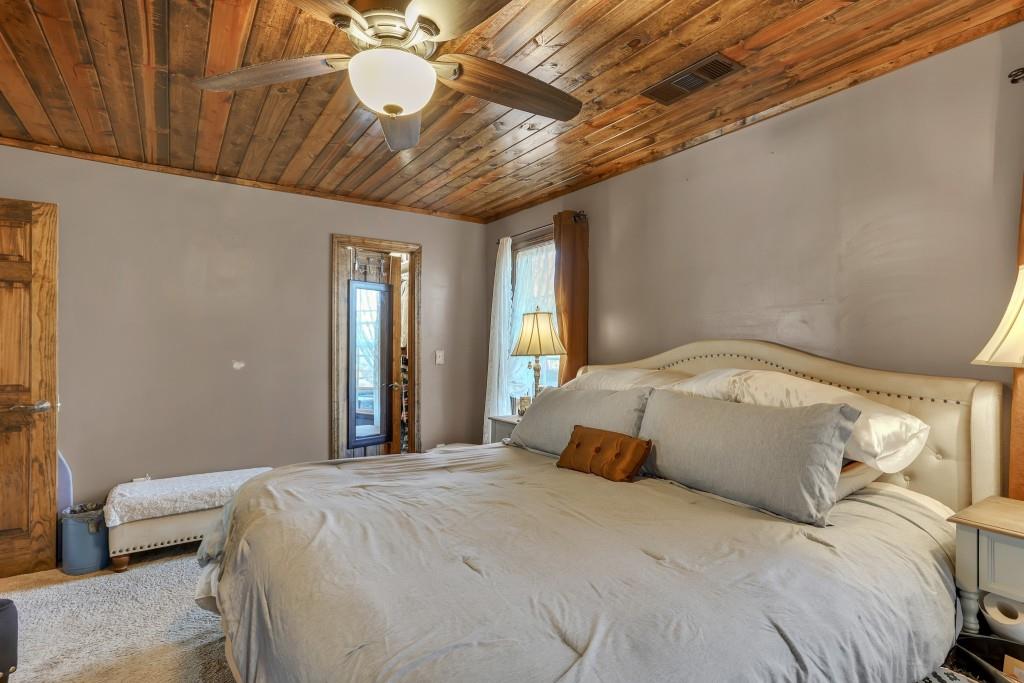 429 Red Oak Court Monroe, GA 30655 - Photo 17 of 40 a bedroom with a bed and a couch