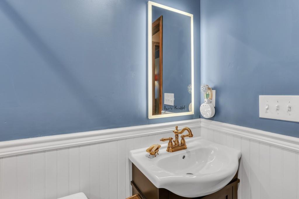 429 Red Oak Court Monroe, GA 30655 - Photo 24 of 40 a bathroom with a sink and a mirror