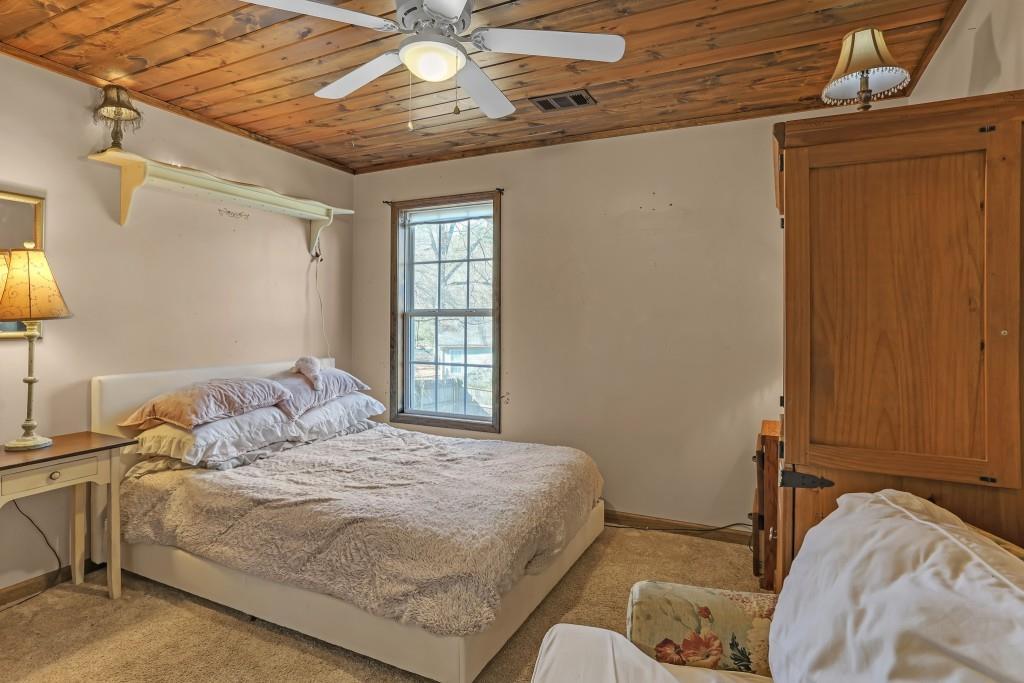 429 Red Oak Court Monroe, GA 30655 - Photo 25 of 40 a bedroom with a bed and a window