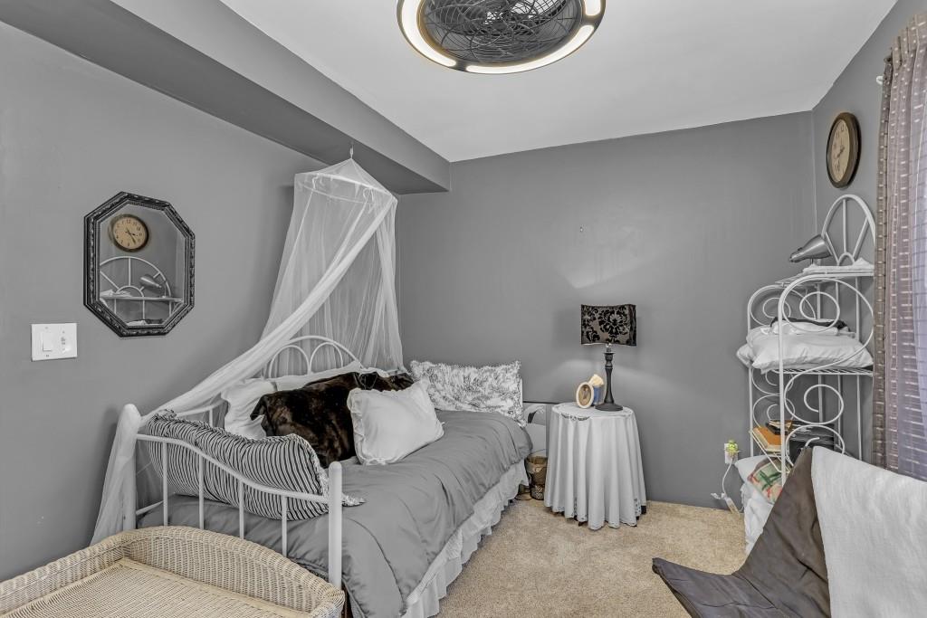 429 Red Oak Court Monroe, GA 30655 - Photo 29 of 40 a bedroom with a bed and curtain