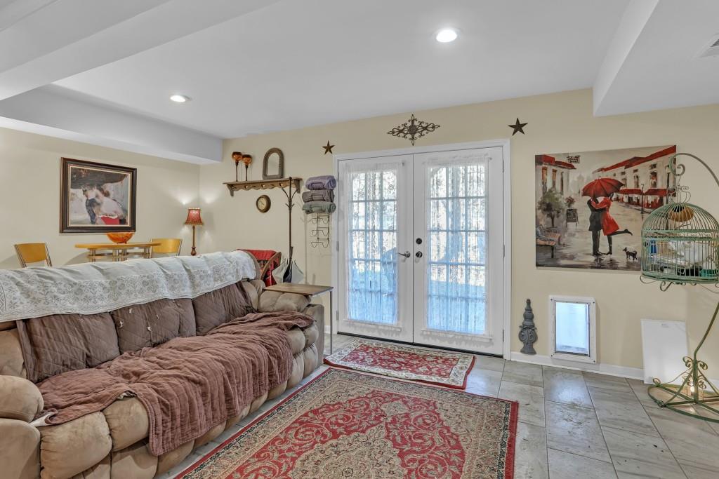 429 Red Oak Court Monroe, GA 30655 - Photo 32 of 40 a bedroom with a large bed and a couch