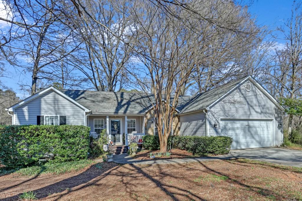 429 Red Oak Court Monroe, GA 30655 - Photo 40 of 40 a front view of a house with a yard and potted plants