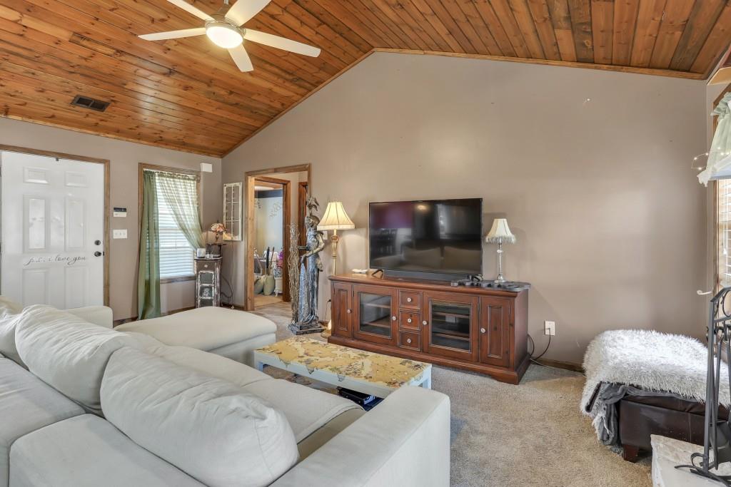 429 Red Oak Court Monroe, GA 30655 - Photo 5 of 40 a bedroom with furniture and a flat screen tv