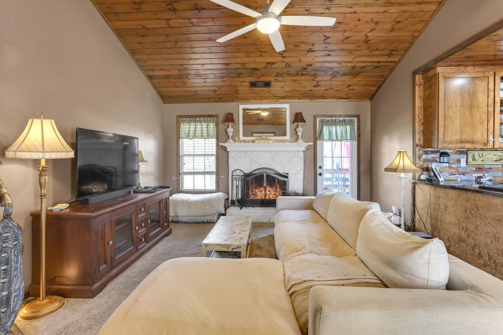 429 Red Oak Court Monroe, GA 30655 - Photo 8 of 40 a living room with furniture and a flat screen tv
