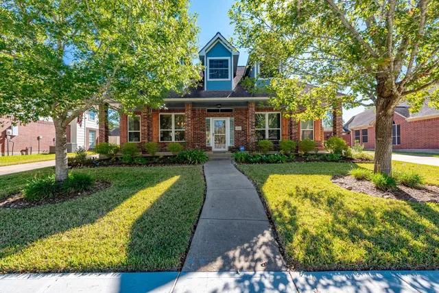 a front view of a house with yard