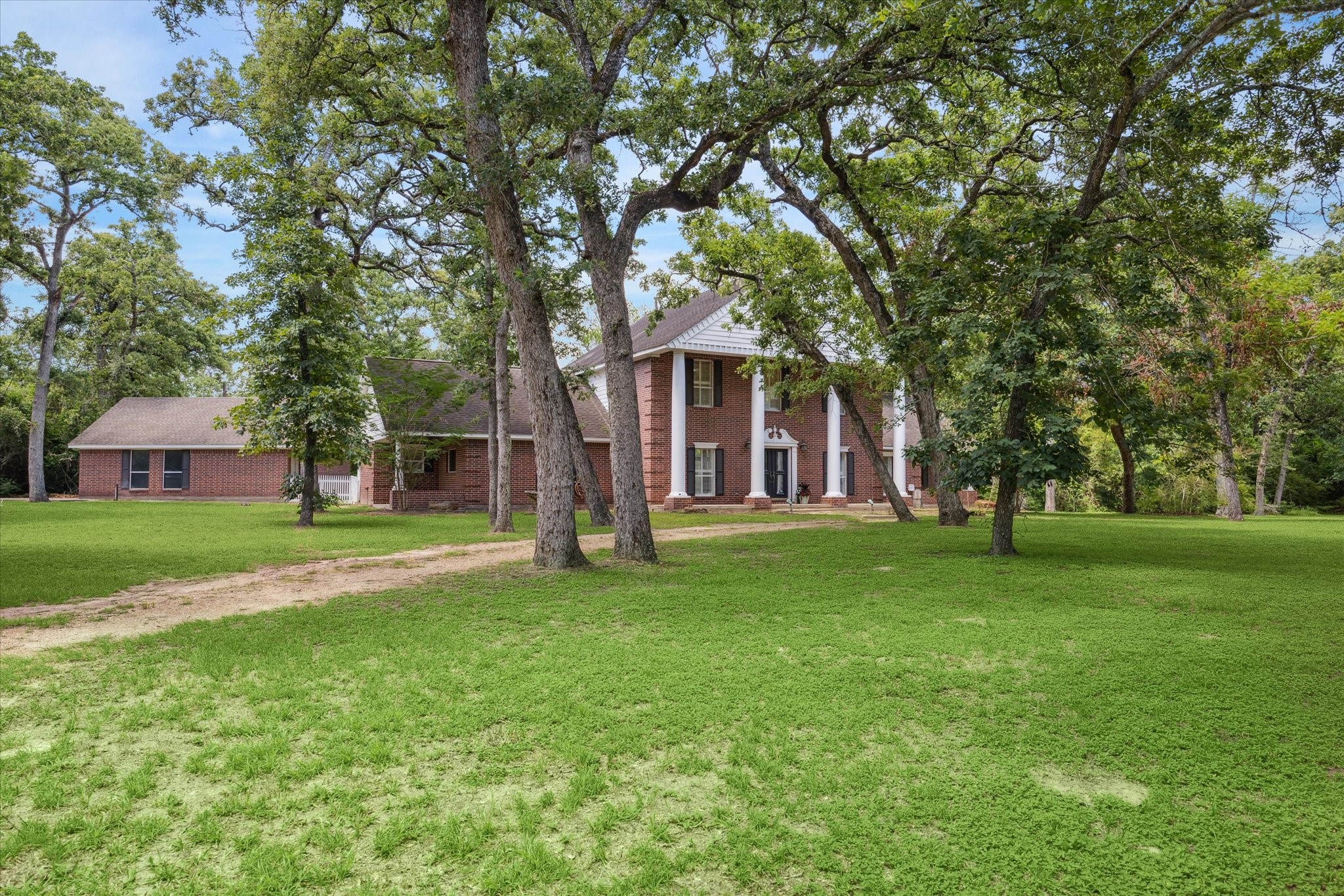 491 Oak Forest Road Bellville, TX 77418 - Photo 2 of 33 a view of a house with a big yard