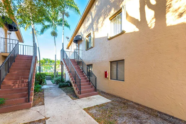 a view of a swimming pool with an outdoor seating