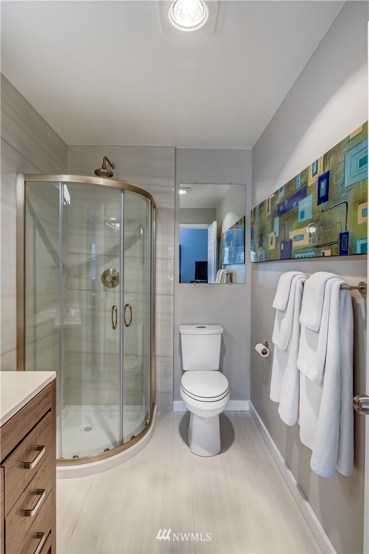 115 West Galer Street, Unit 101 Seattle, WA 98119 - Photo 16 of 23 a bathroom with a toilet sink and shower