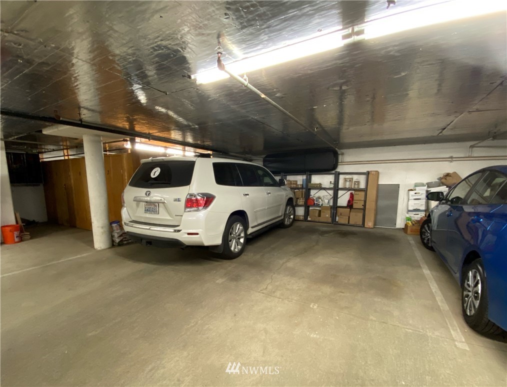115 West Galer Street, Unit 101 Seattle, WA 98119 - Photo 20 of 23 a view of parking garage with cars parked