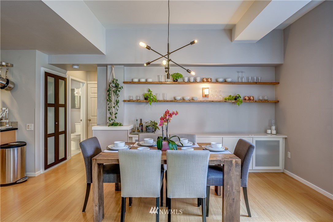 115 West Galer Street, Unit 101 Seattle, WA 98119 - Photo 4 of 23 a view of a dining room with furniture