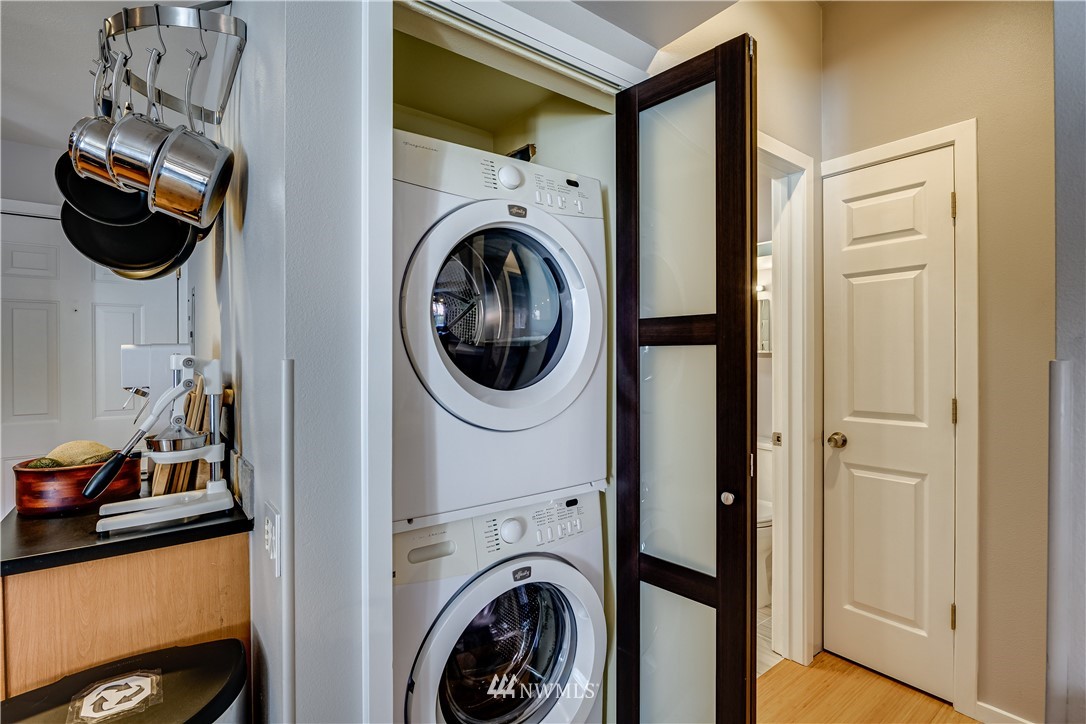 115 West Galer Street, Unit 101 Seattle, WA 98119 - Photo 7 of 23 a view of a storage and utility room with a washer dryer