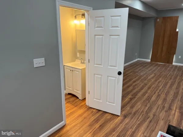 a view of front door with wooden floor