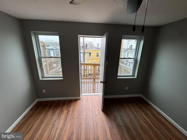 a view of balcony with wooden floor