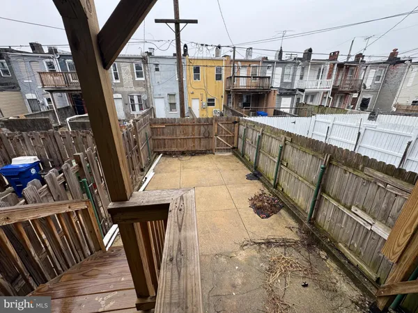 a view of a balcony with wooden floor