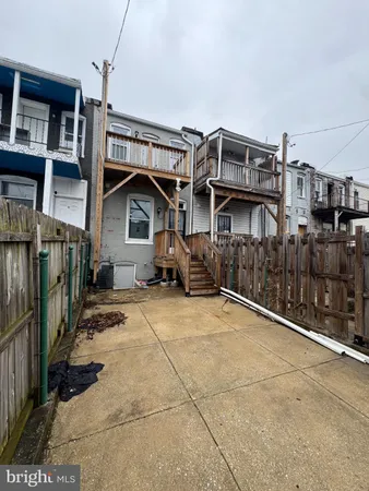 a view of a house with wooden walls