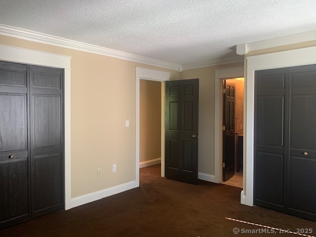 27 Canterbury Lane, Unit 27 Avon, CT 06001 - Photo 11 of 17 an empty room with closet and a bathroom