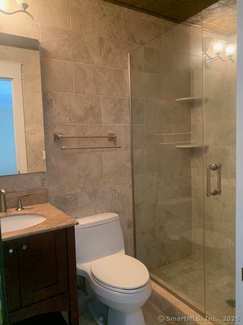 27 Canterbury Lane, Unit 27 Avon, CT 06001 - Photo 12 of 17 a bathroom with a sink a toilet and shower