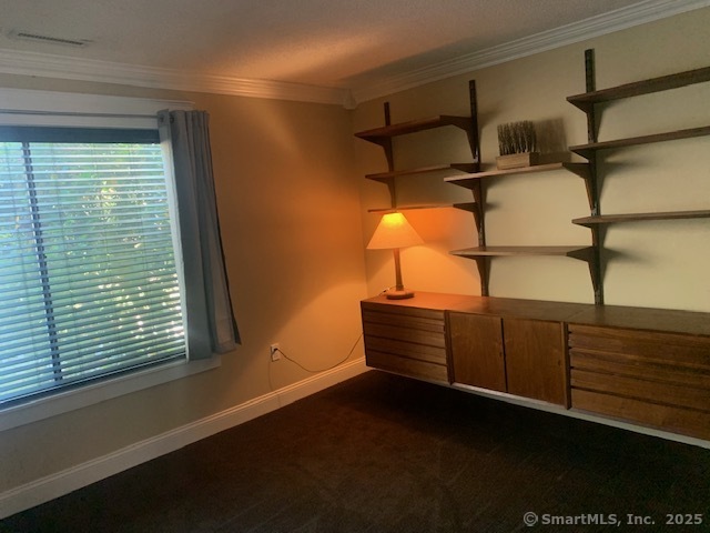 27 Canterbury Lane, Unit 27 Avon, CT 06001 - Photo 14 of 17 a wooden bench sitting in a room