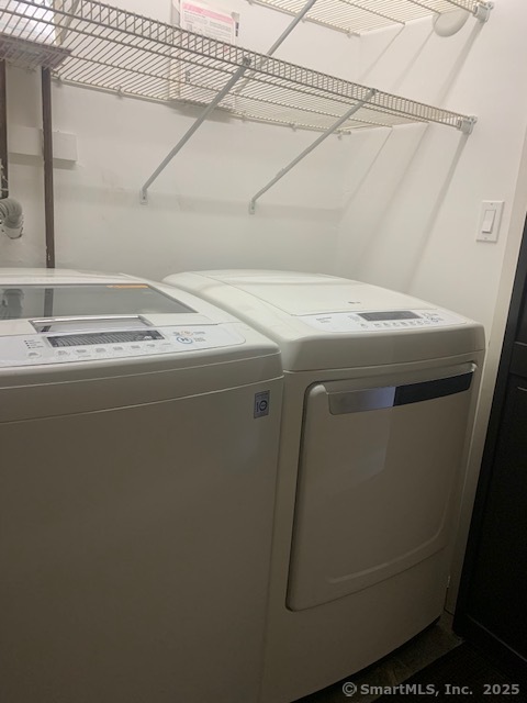 27 Canterbury Lane, Unit 27 Avon, CT 06001 - Photo 15 of 17 a utility room with dryer and washer