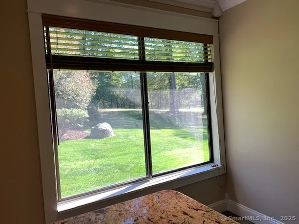 a view of a room that has a large window