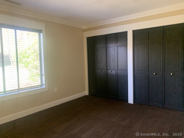 27 Canterbury Lane, Unit 27 Avon, CT 06001 - Photo 10 of 17 an empty room with windows