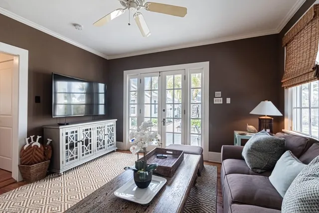 a bedroom with furniture and a large window