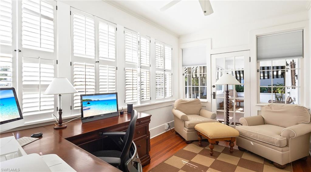 187 Broad Avenue South Naples, FL 34102 - Photo 19 of 33 a living room with furniture and a large window