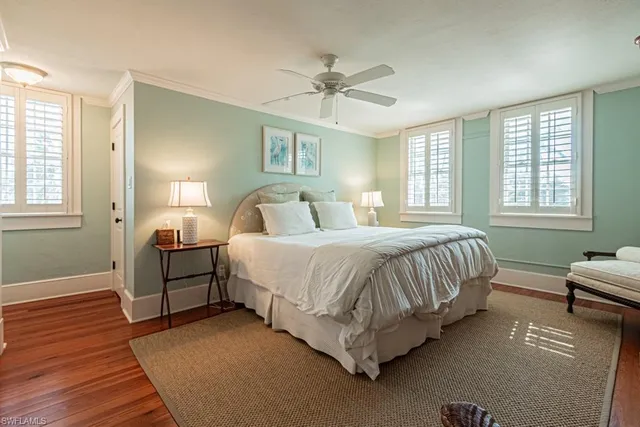 a spacious bedroom with a bed and a window