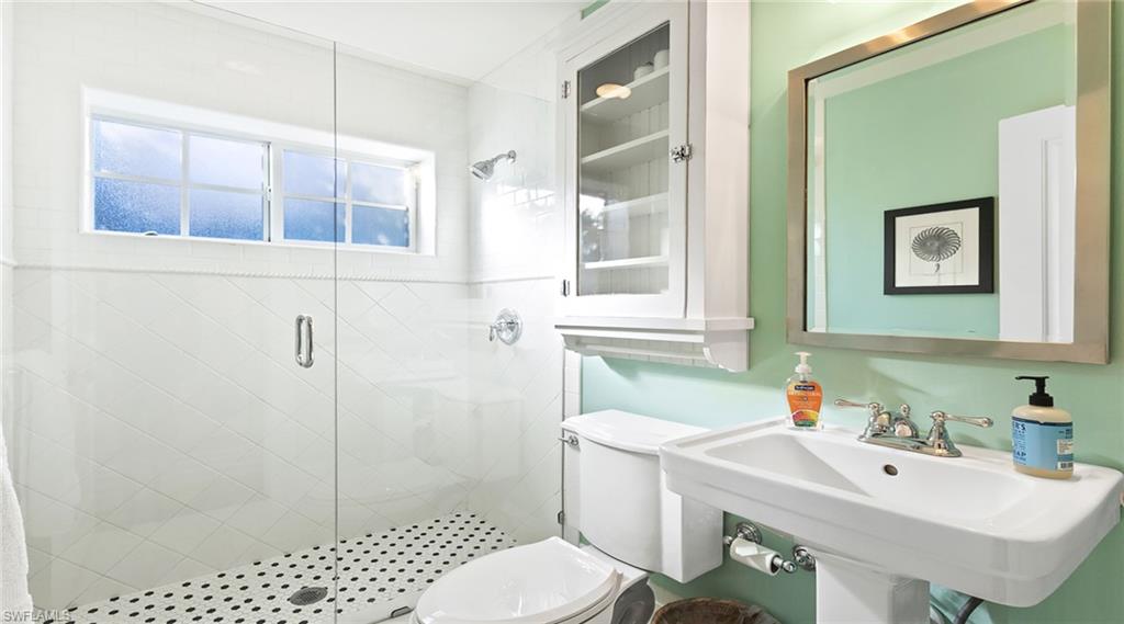 187 Broad Avenue South Naples, FL 34102 - Photo 26 of 33 a bathroom with a sink toilet and shower