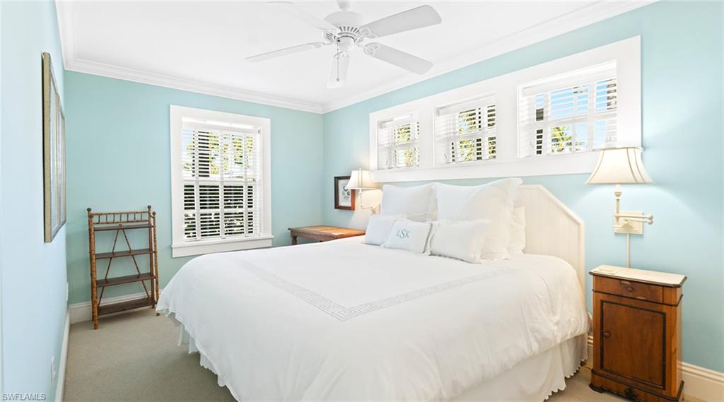 187 Broad Avenue South Naples, FL 34102 - Photo 27 of 33 a bedroom with a bed and a window