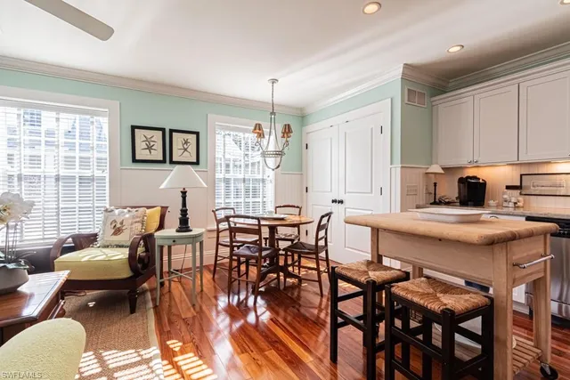 a kitchen with granite countertop lots of counter top space and dining table