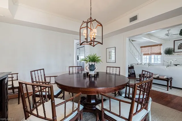 a view of a dining room with furniture and window