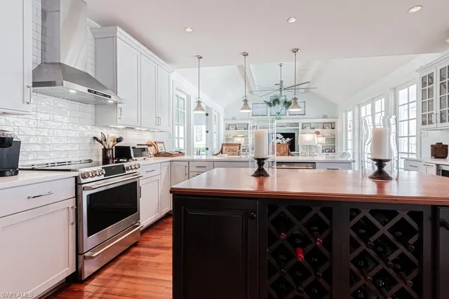a kitchen with stainless steel appliances a sink and a view of kitchen