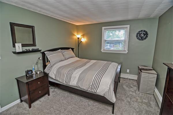 28 Lohnes Road Framingham, MA 01701 - Photo 10 of 14 a bedroom with a bed and wall painting