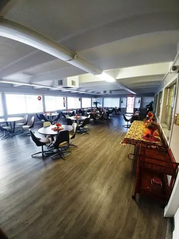 a view of a swimming pool with an outdoor seating